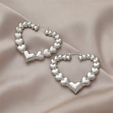 Dazzling silver-plated heart hoop earrings, perfect for expressing love and style in one accessory.